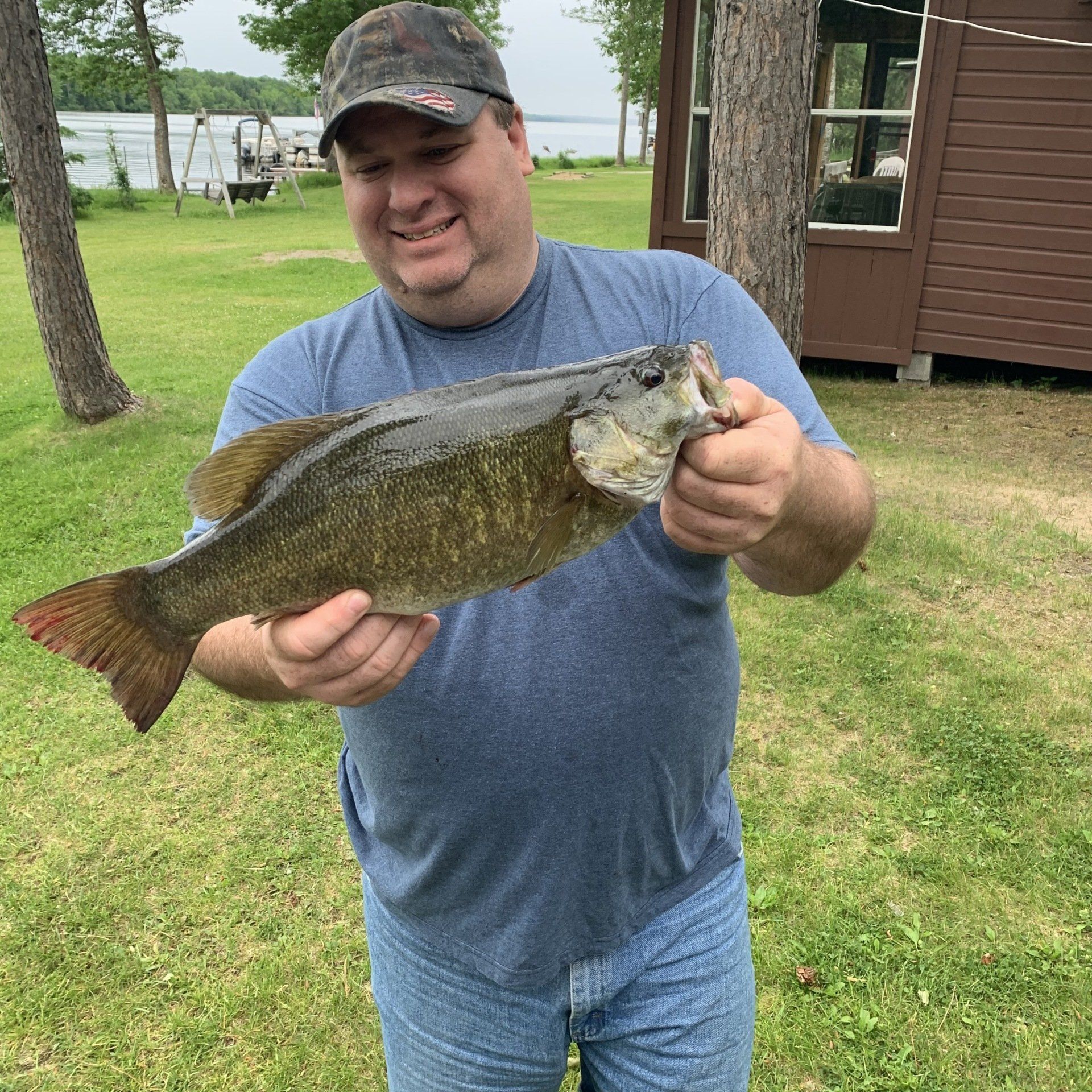 man-showing-caught-fish