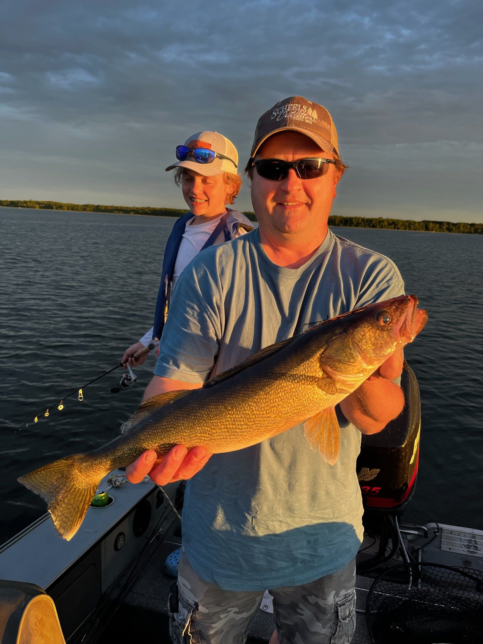 man-showing-caught-fish