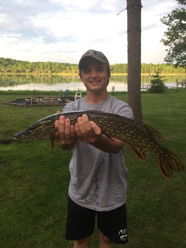 boy-showing-caught-fish