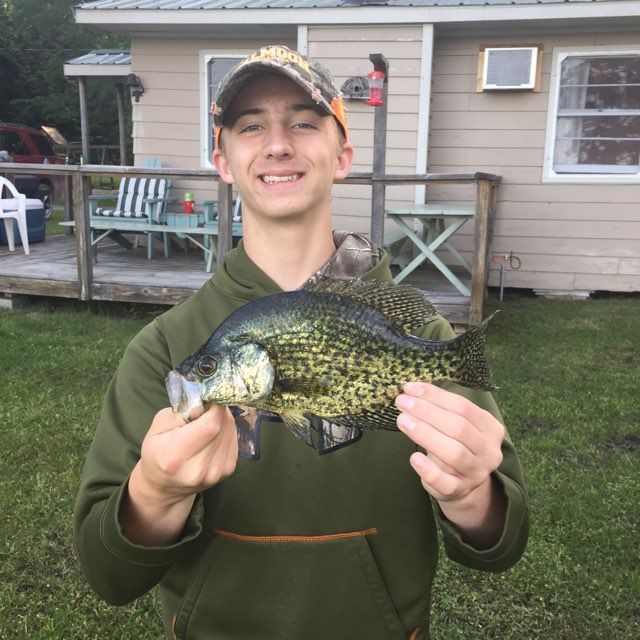 man-showing-caught-fish