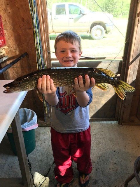 boy-showing-caught-fish