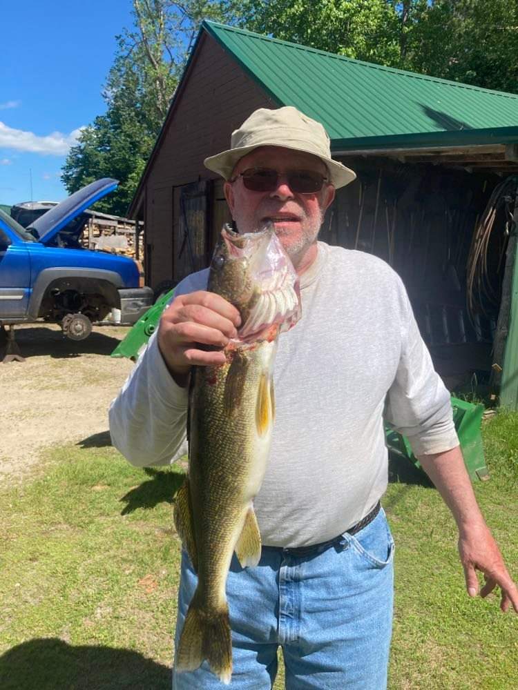 man-showing-caught-fish