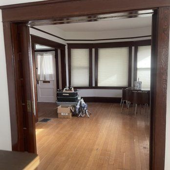 A basement is being remodeled and there is a lot of stuff on the floor.