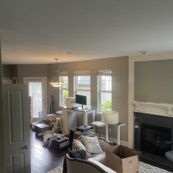 A living room filled with furniture and a fireplace.
