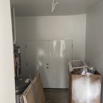 A room with white walls and a box on the floor.