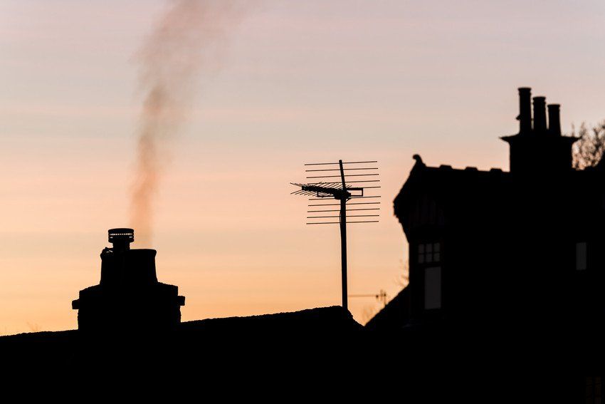 Residential rooftops with chimneys