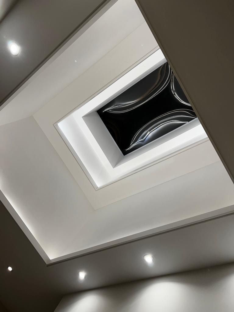 Looking up at the ceiling of a room with lights on