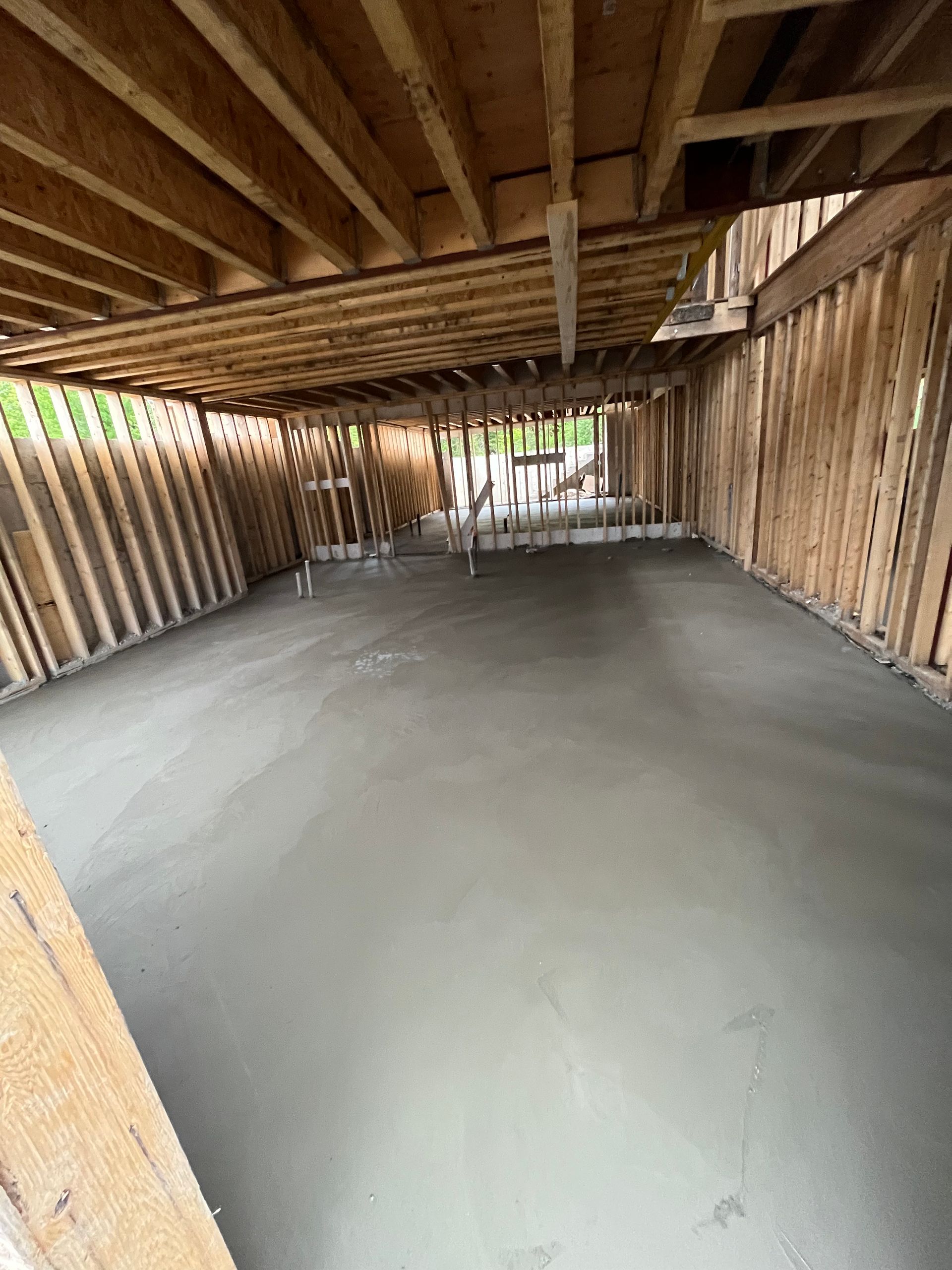 A concrete floor in a building under construction.