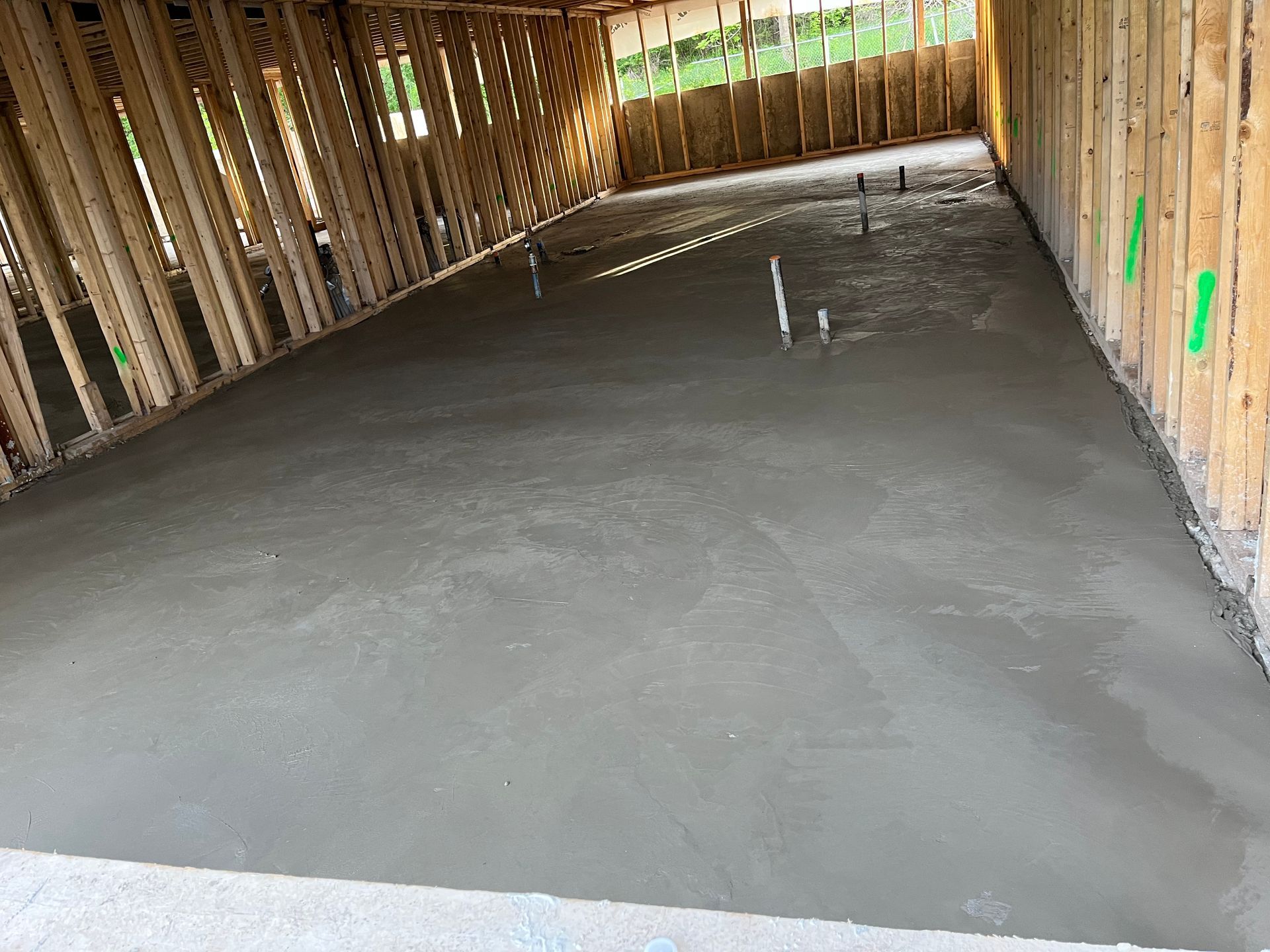 A concrete floor in a building under construction.