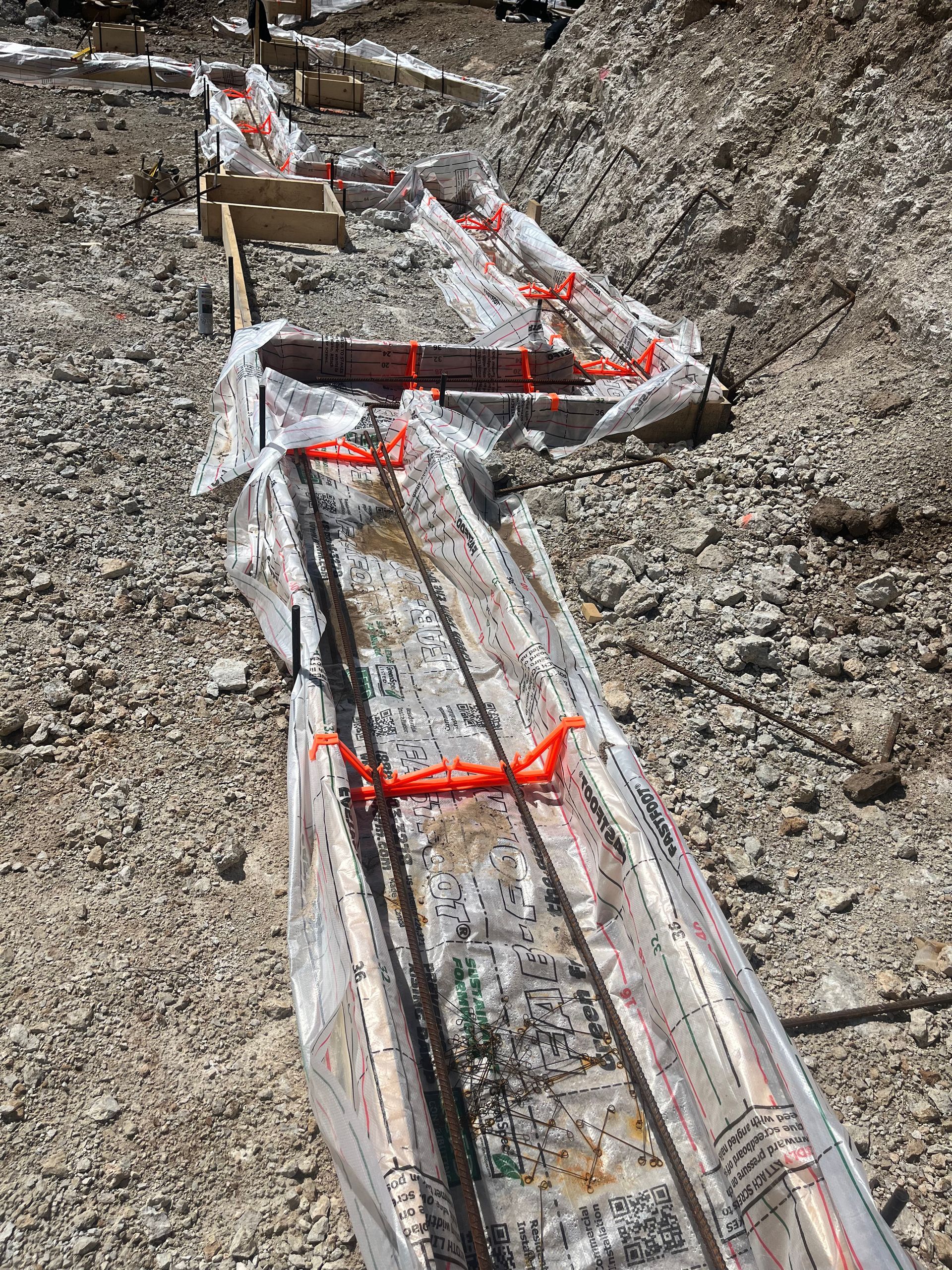 A construction site with a lot of rocks and concrete.