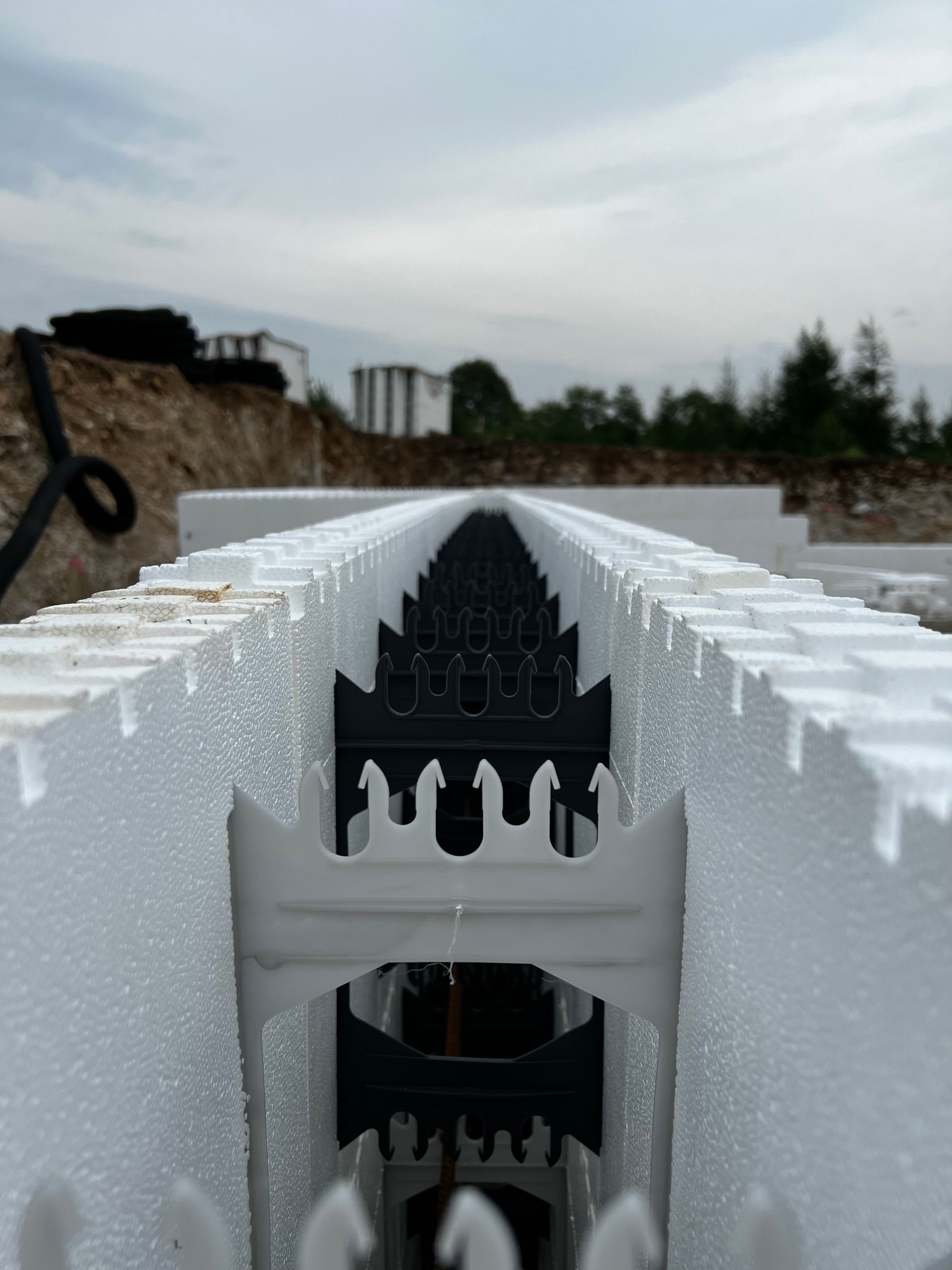 A row of styrofoam blocks sitting on top of each other on a construction site.