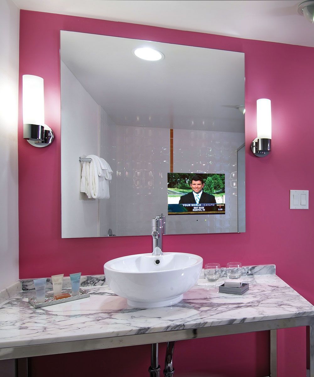 A bathroom with a sink and a large mirror