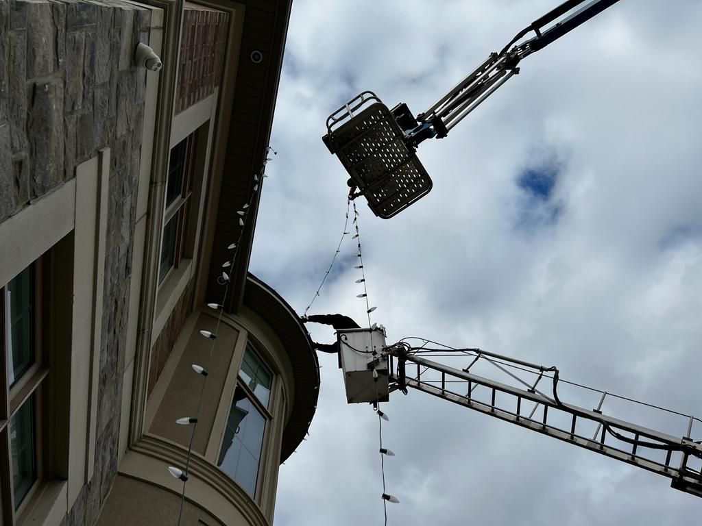 A crane is attached to the side of a building