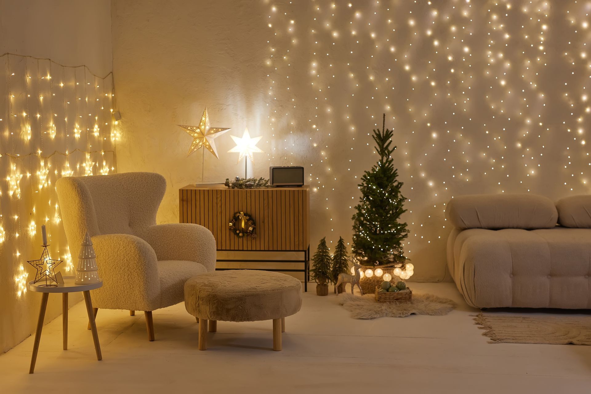 A living room decorated for christmas with a christmas tree and a couch.