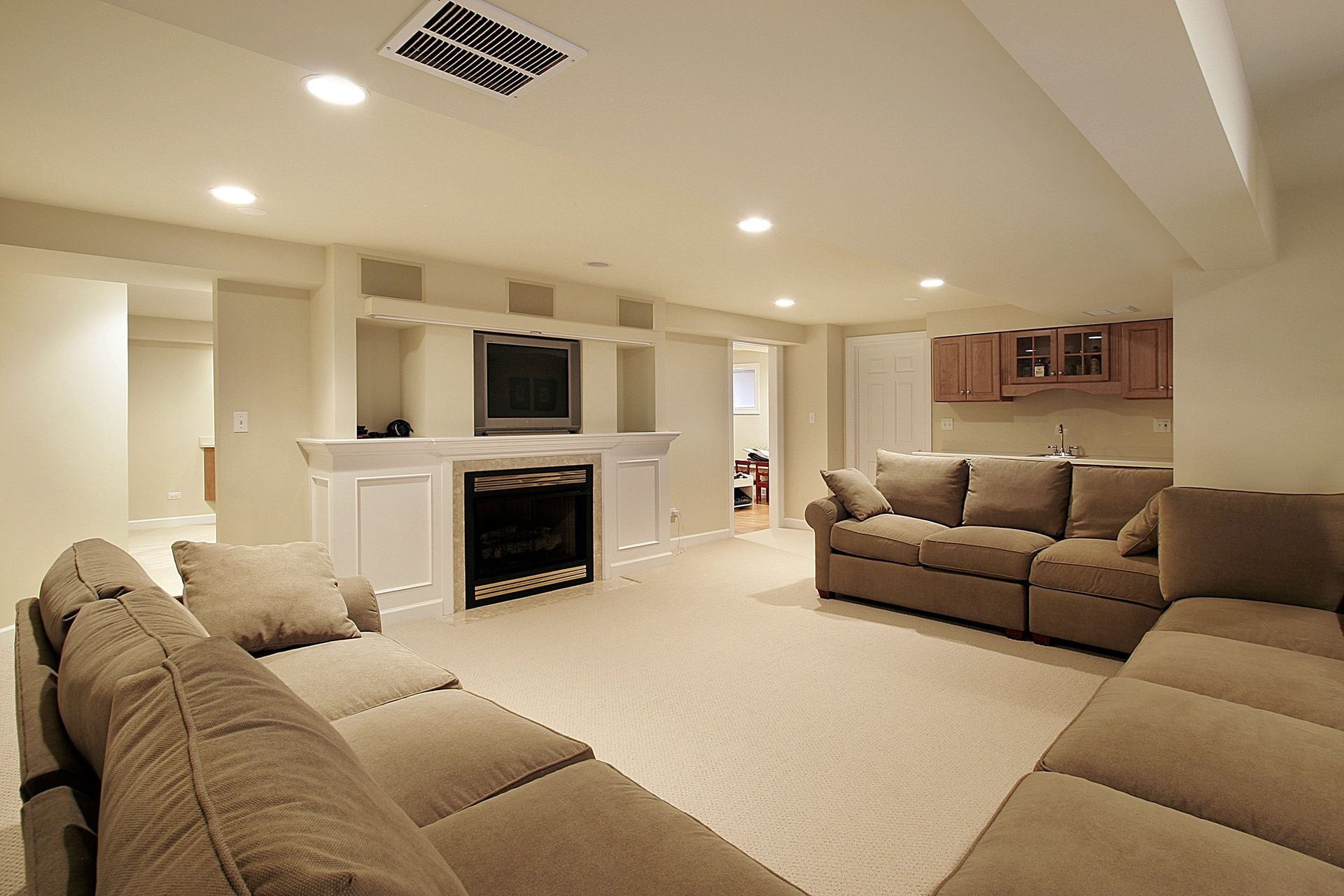 A living room with a couch and a fireplace