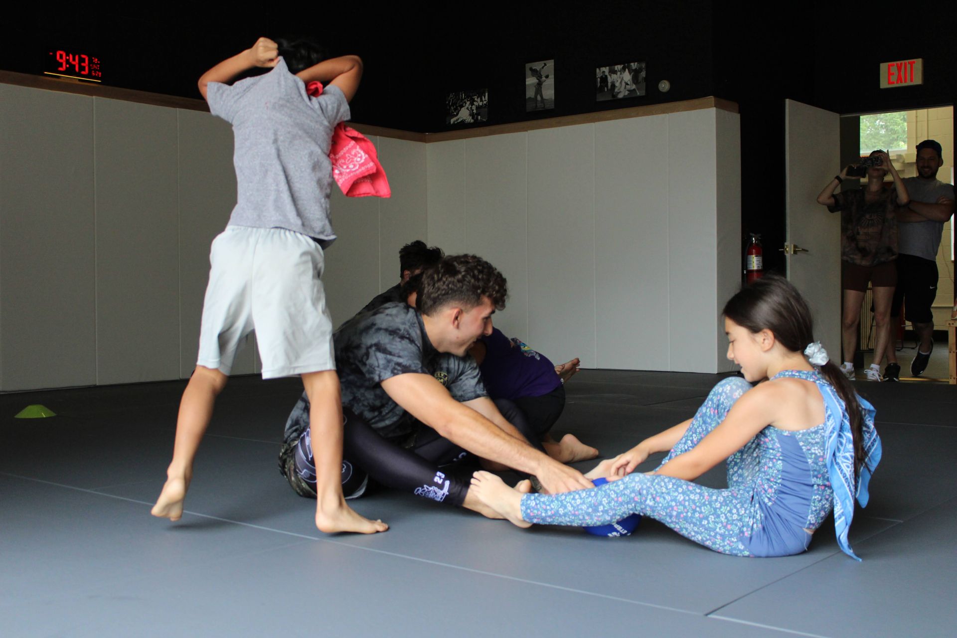 Family training on the mats at Lucky Cat Grappling Co. in Manalapan, NJ, building teamwork.