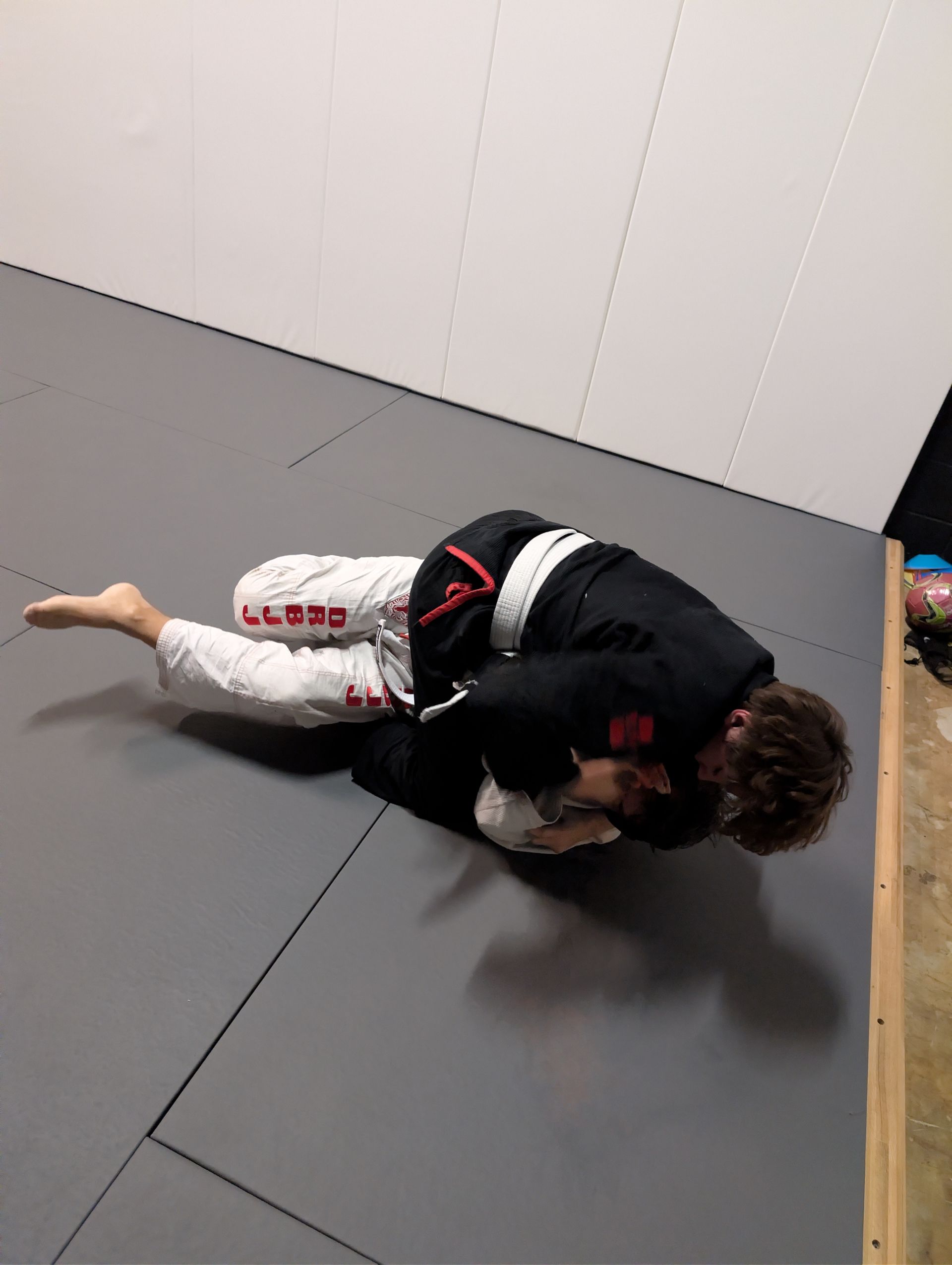 Beginners drilling Brazilian Jiu-Jitsu positions at Lucky Cat Grappling Co. in Manalapan, NJ.