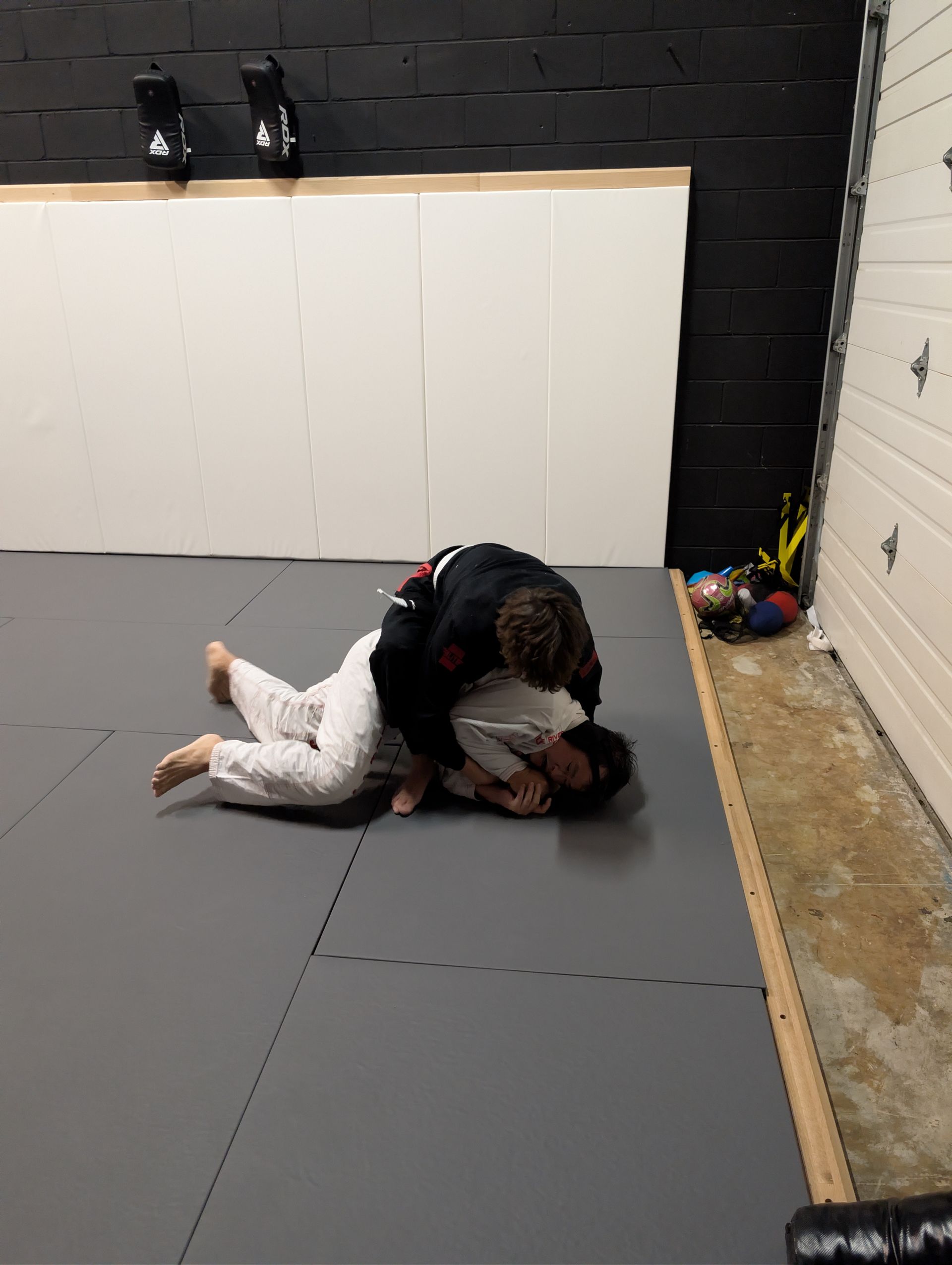 Students train Brazilian Jiu-Jitsu at Lucky Cat Grappling Co. in Manalapan, NJ, building resilience 