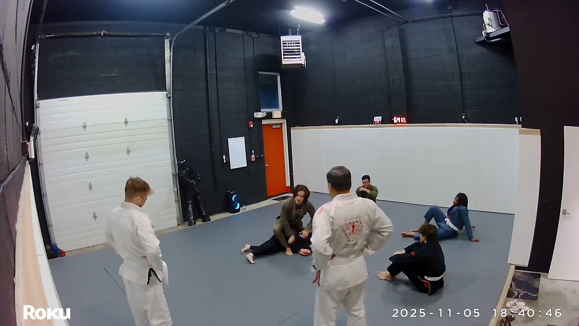 Adult and youth students drilling Jiu-Jitsu technique at Lucky Cat Grappling Co. in Manalapan, NJ.