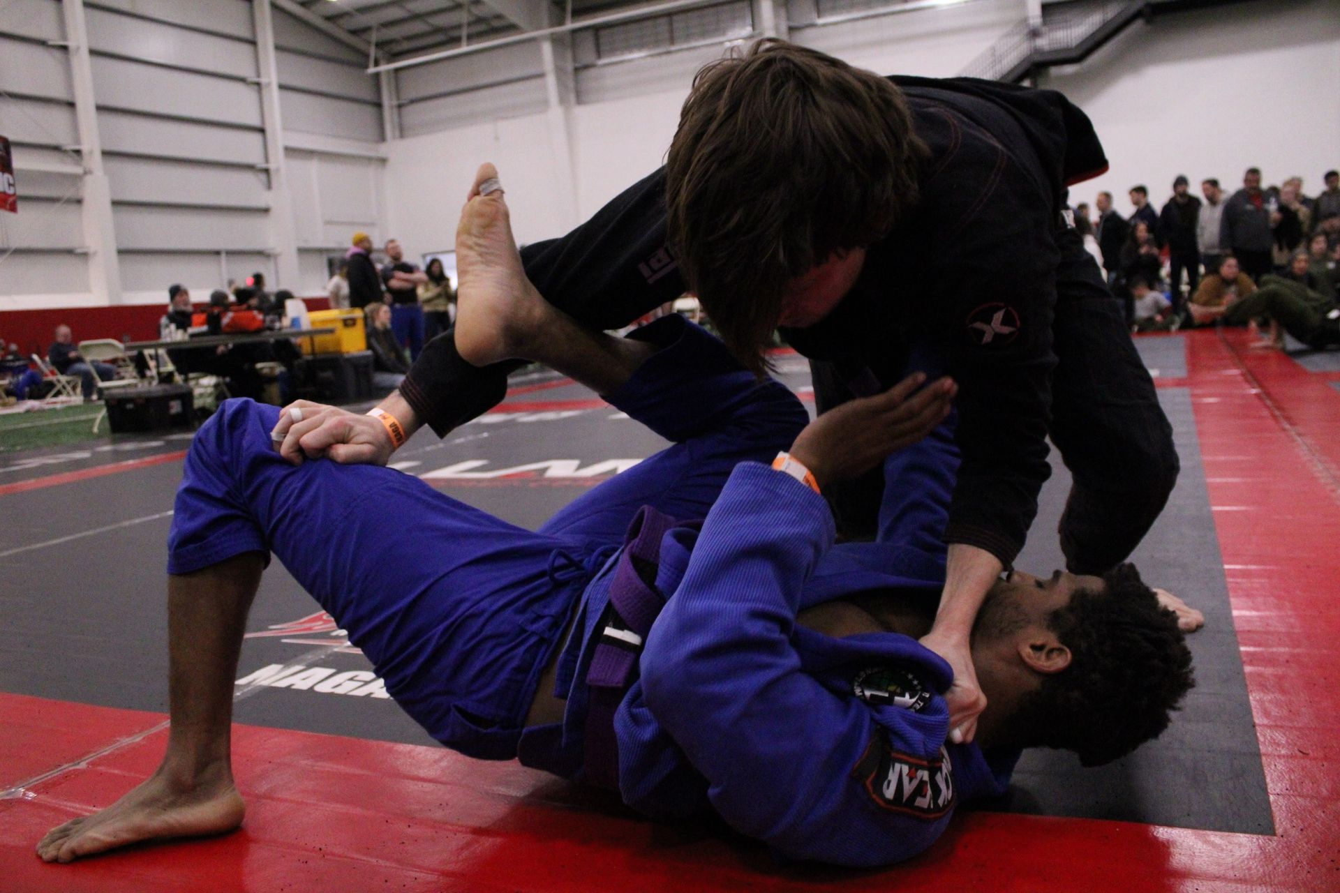 Students drilling hip mobility for Jiu Jitsu at Lucky Cat Grappling Co. in Manalapan, NJ for safer movement.