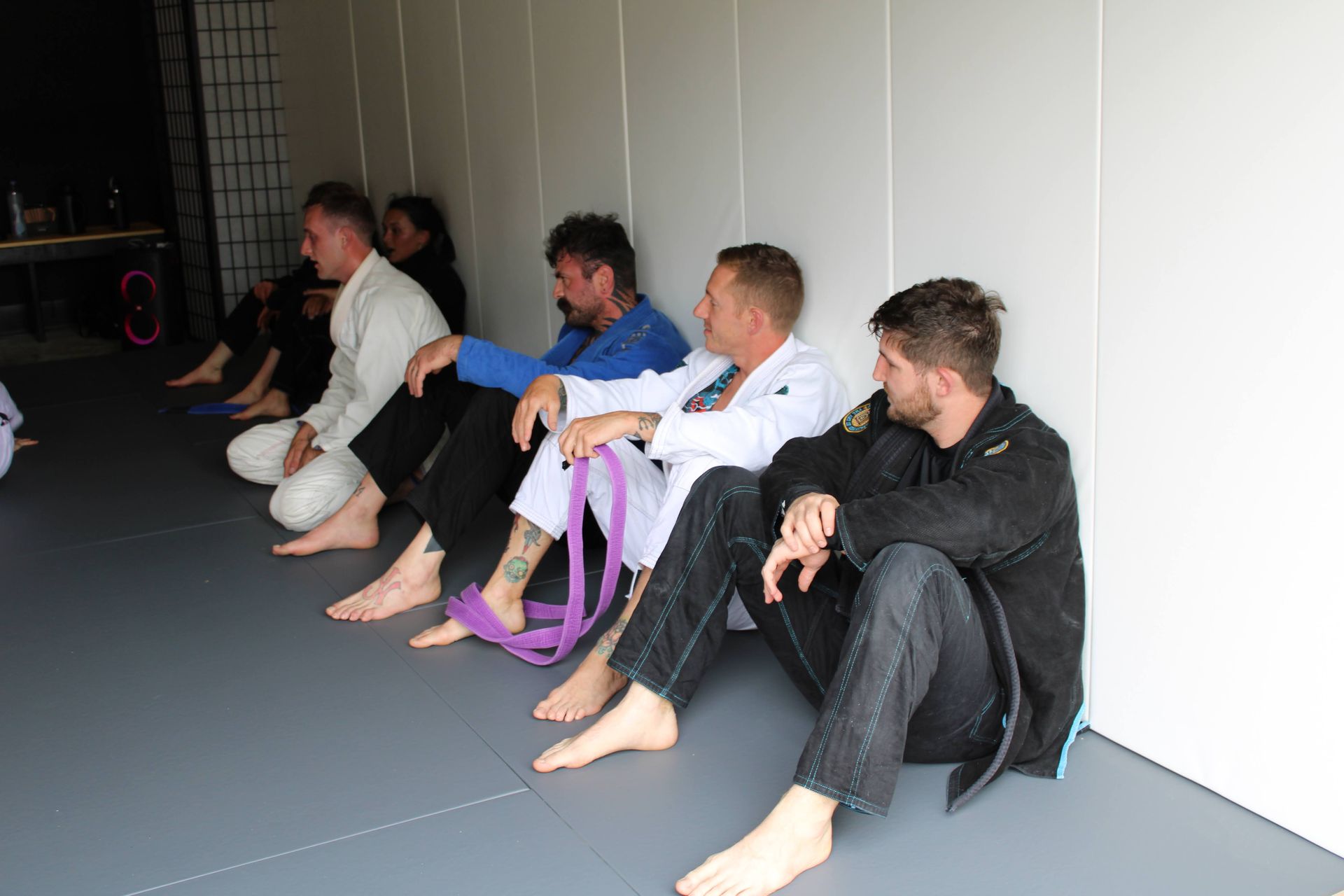 Students practicing Brazilian Jiu Jitsu drills at Lucky Cat Grappling Co. in Manalapan, NJ to build calm focus.