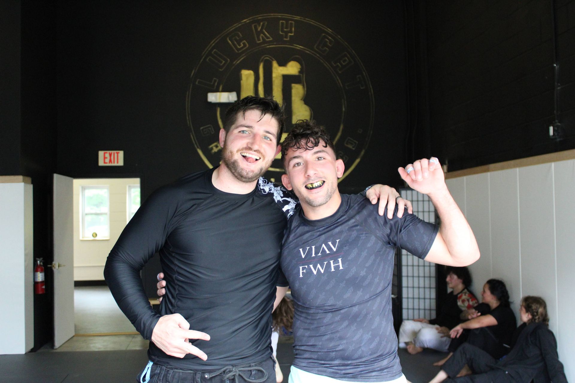 Adult students drilling Brazilian Jiu-Jitsu technique at Lucky Cat Grappling Co. in Manalapan, NJ.