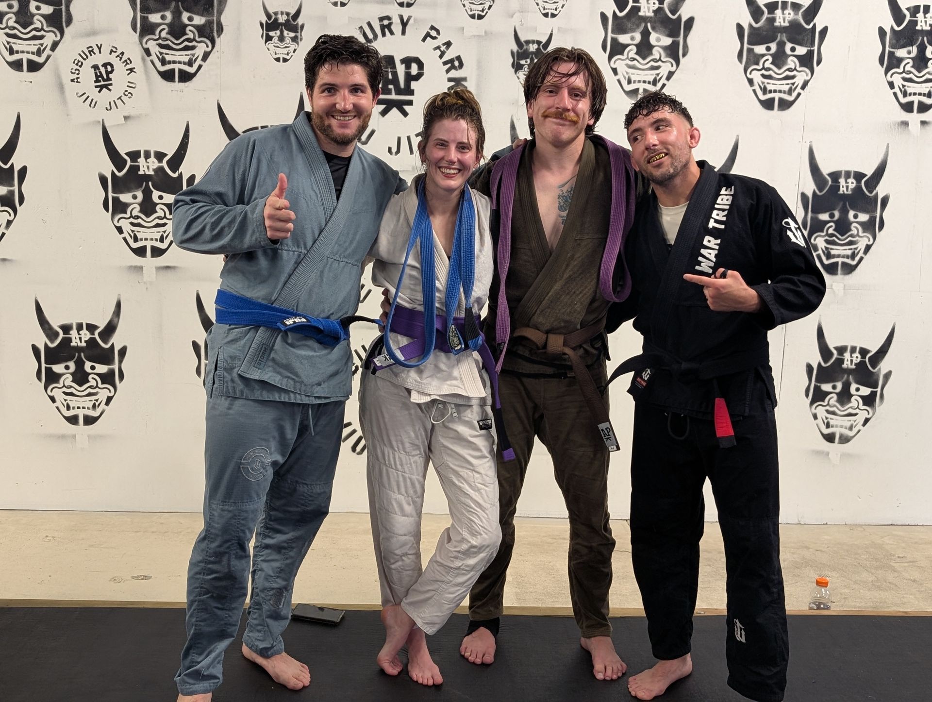 Partners drill Jiu Jitsu techniques at Lucky Cat Grappling Co. in Manalapan, NJ, building trust and friendships.