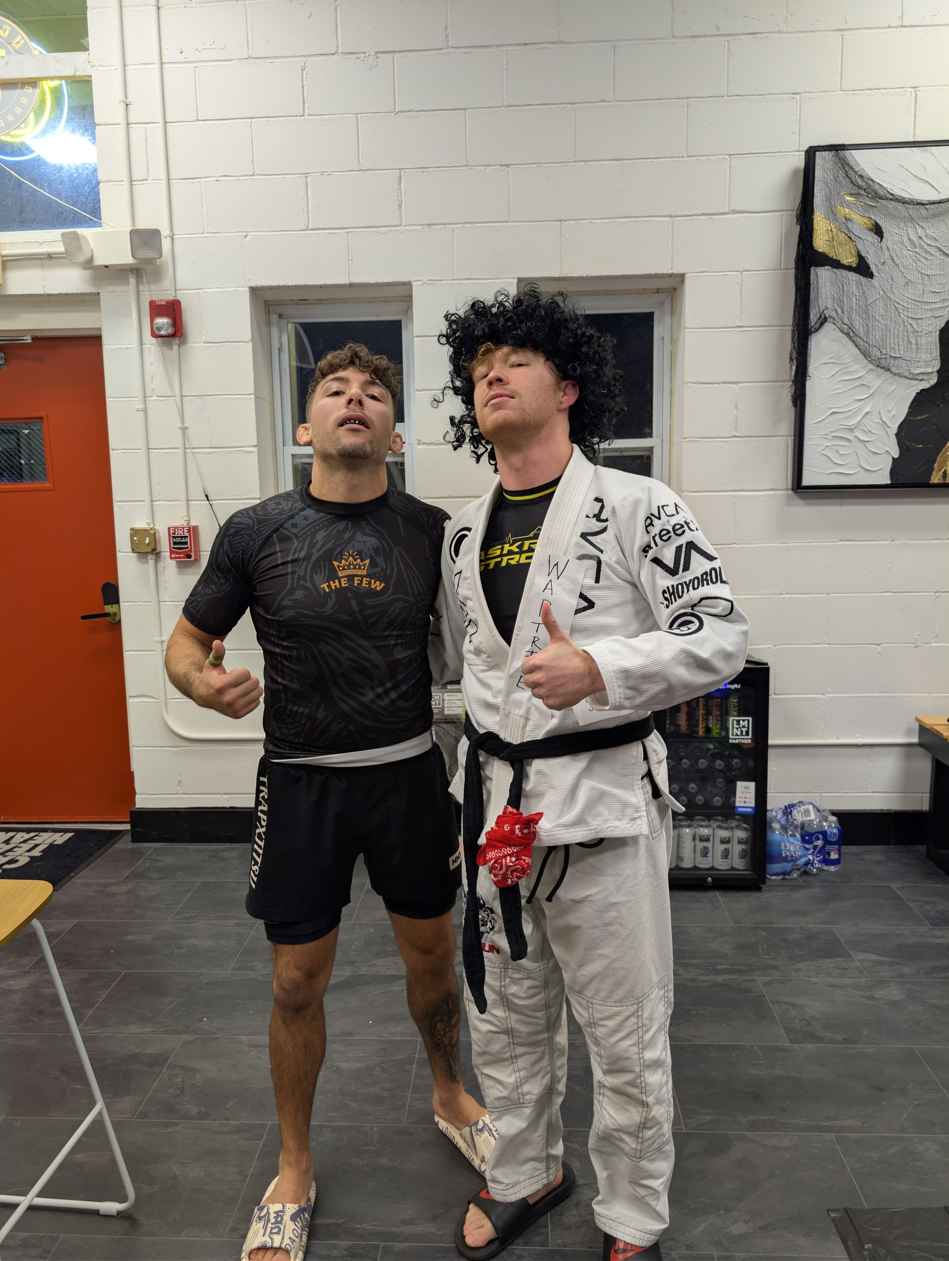 Adults practicing Brazilian Jiu Jitsu drills at Lucky Cat Grappling Co. in Manalapan, NJ to reduce stress