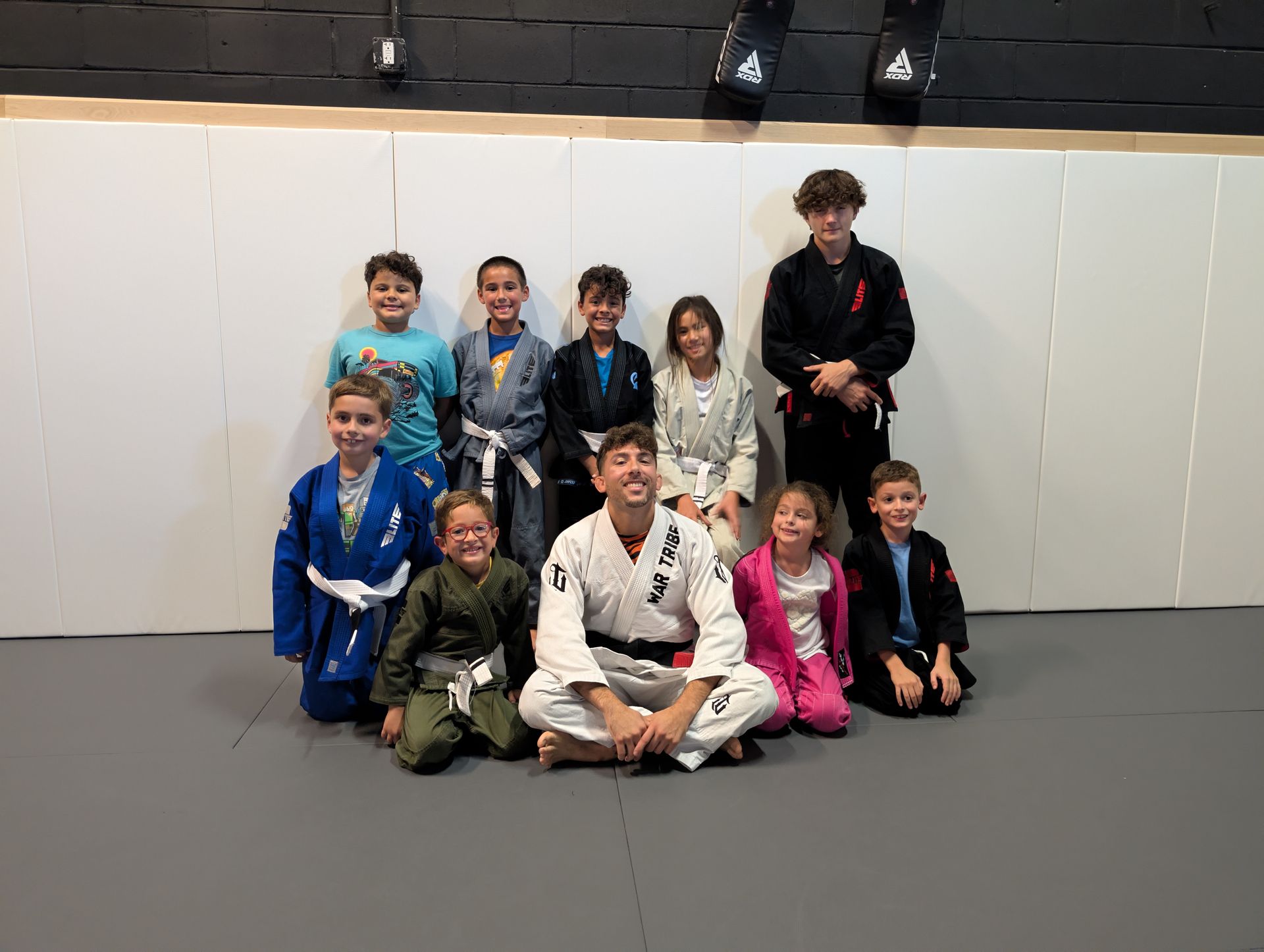 Teens drilling Brazilian Jiu Jitsu techniques at Lucky Cat Grappling Co. in Manalapan, NJ.