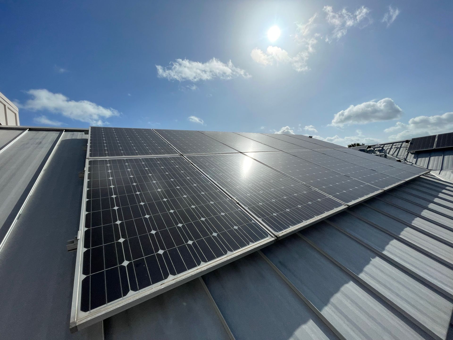 A roof with a lot of solar panels on it