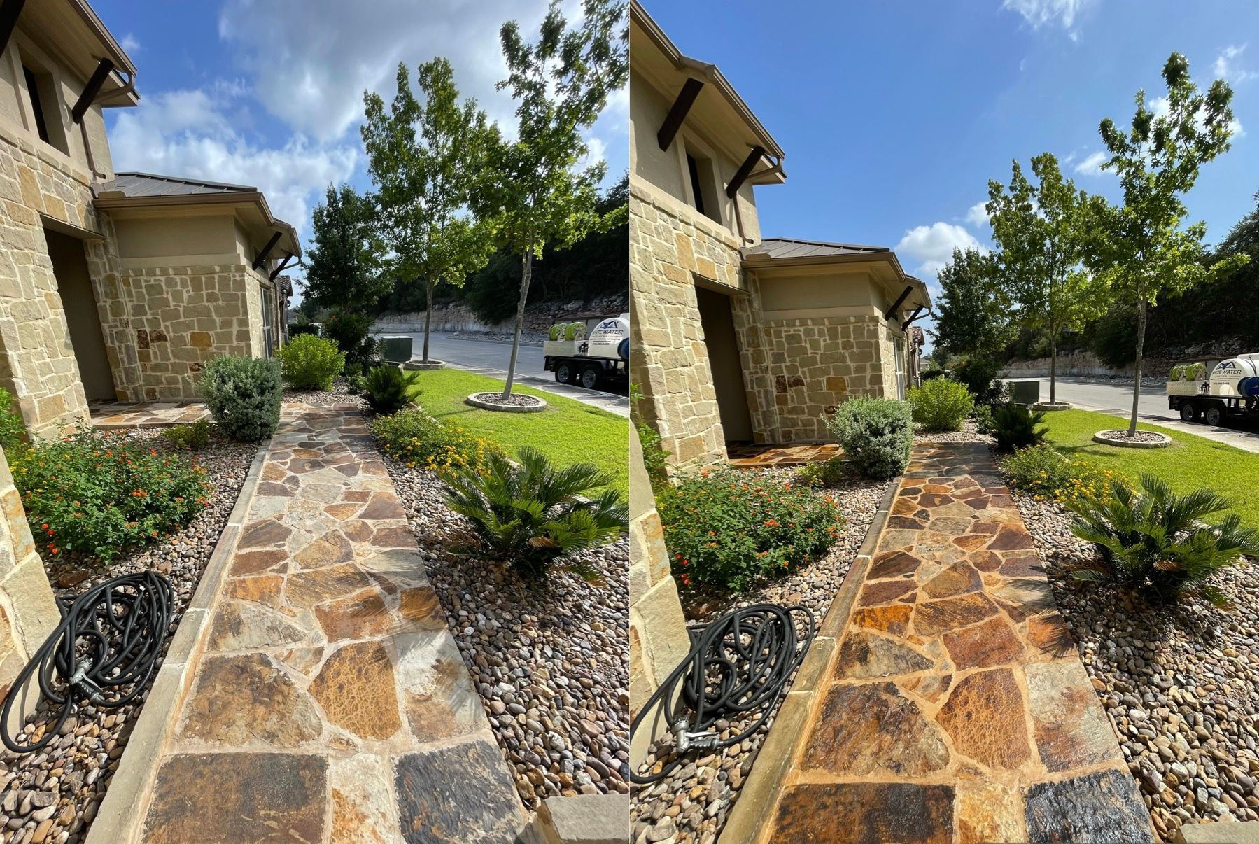 A brick walkway leading to a house in the woods.