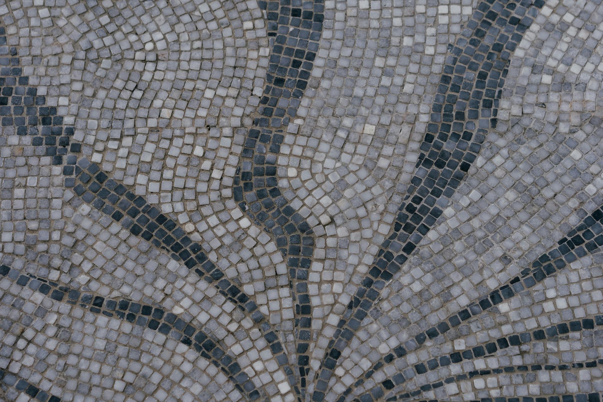 A close up of a mosaic with a circular pattern