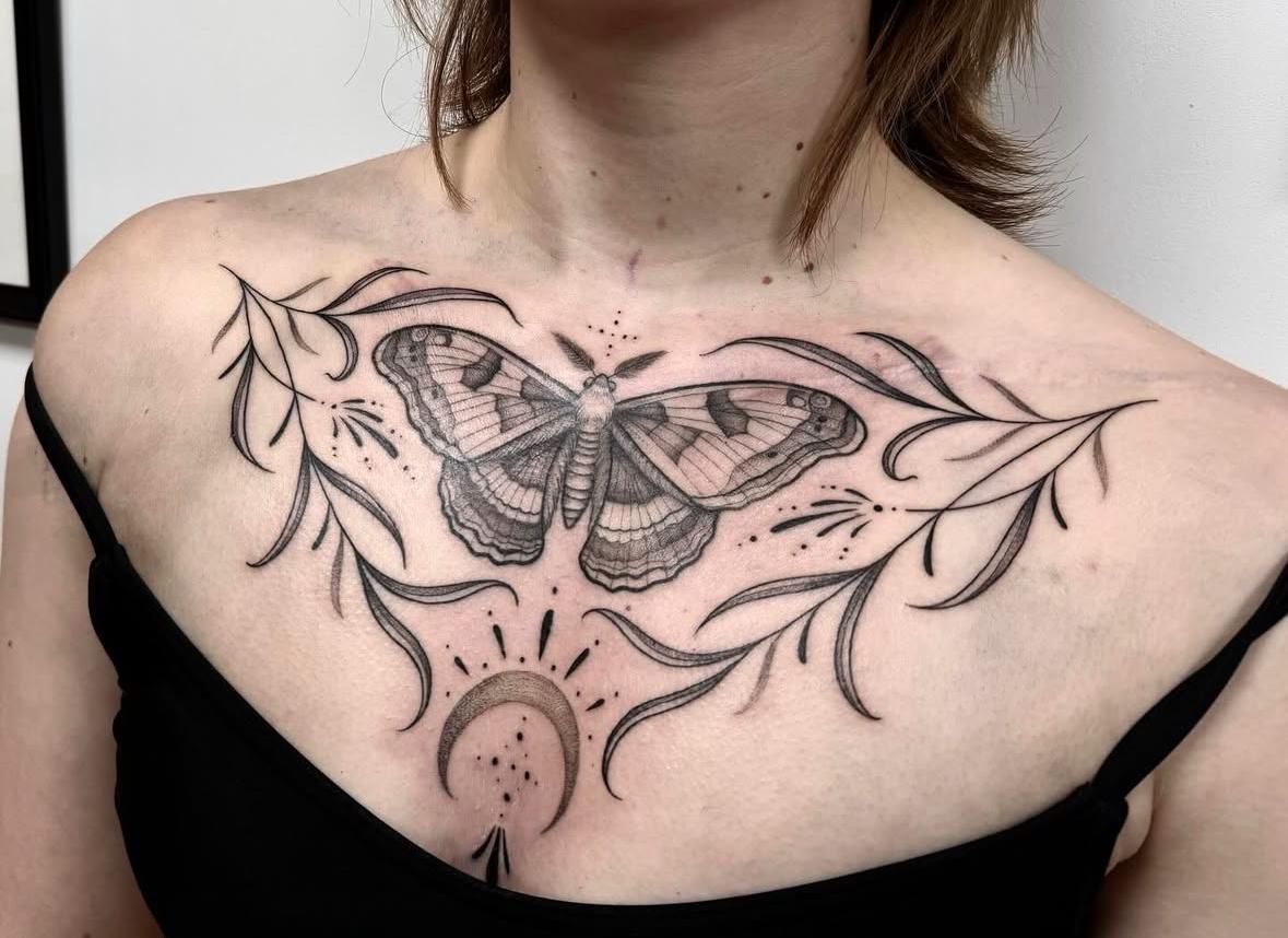 Chest tattoo door Marije Kootstra van Sideways Tattoo Leeuwarden. Chest piece, butterfly tattoo branches moon tattoo dotwork