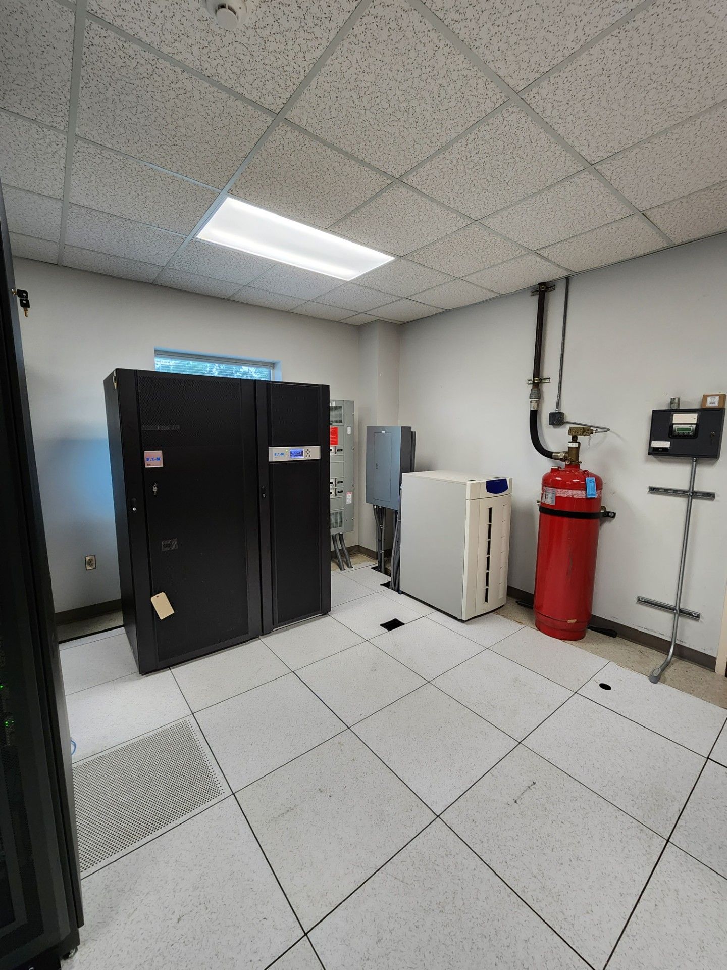 There is a fire extinguisher in the middle of the room.