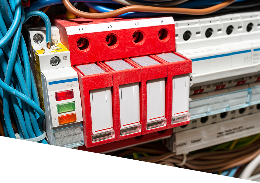 A red and white electrical device is sitting on top of a electrical box.