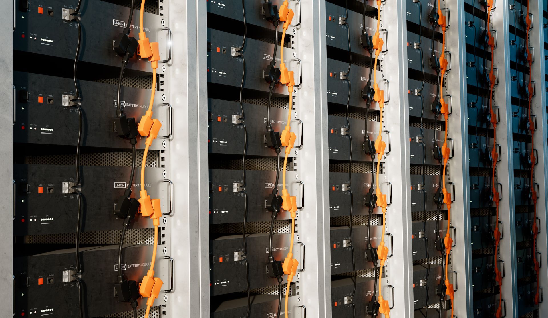 A row of servers in a data center with orange wires hanging from them.