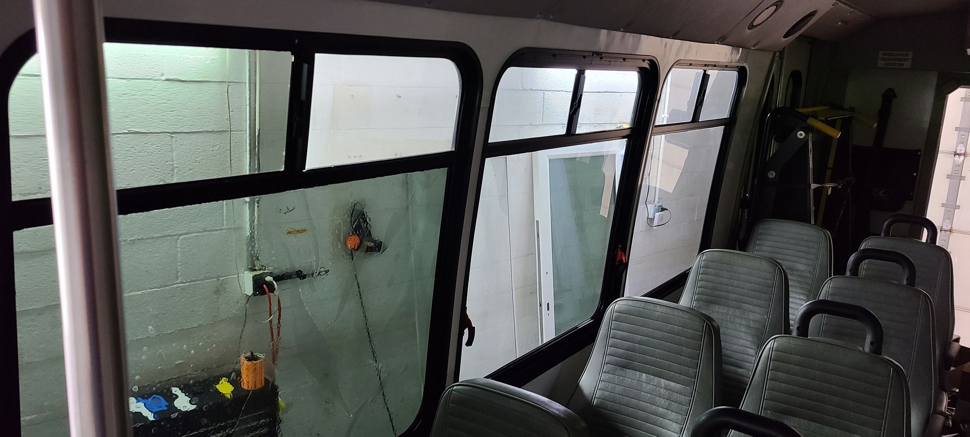 The inside of a bus with a lot of windows and seats.