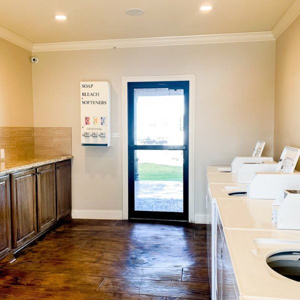 A kitchen with a sign on the wall that says recycle
