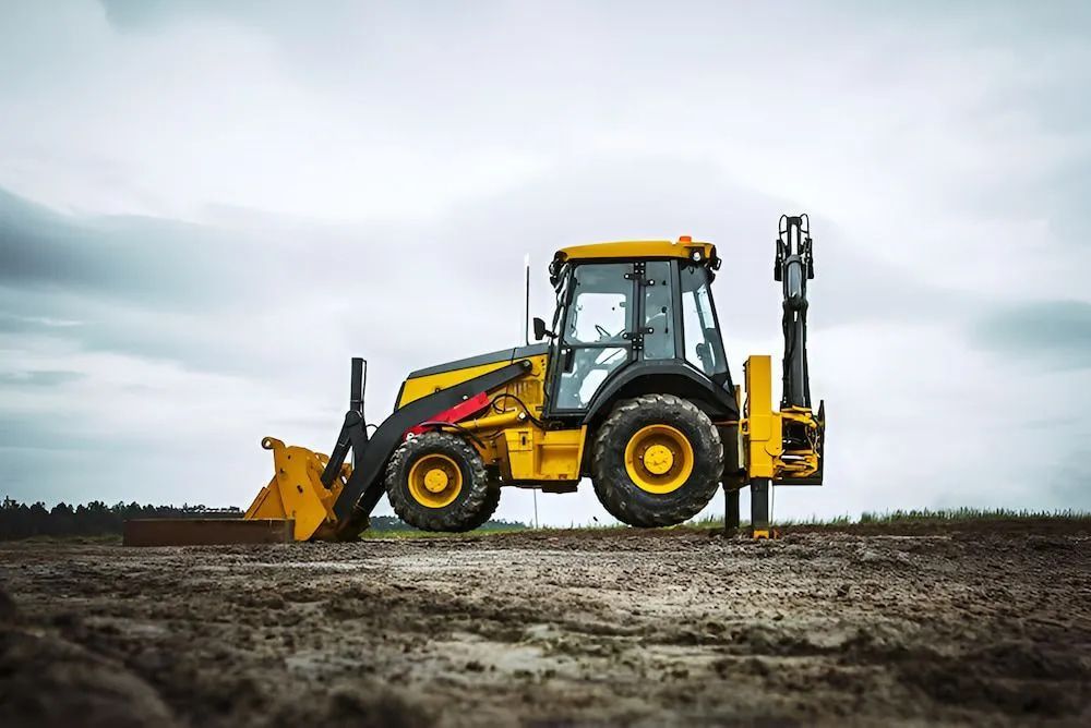 A Yellow and Black Tractor Is Parked in A Dirt Field — Jeff Thompson Excavator Hire Pty Ltd In Pink Lily, QLD