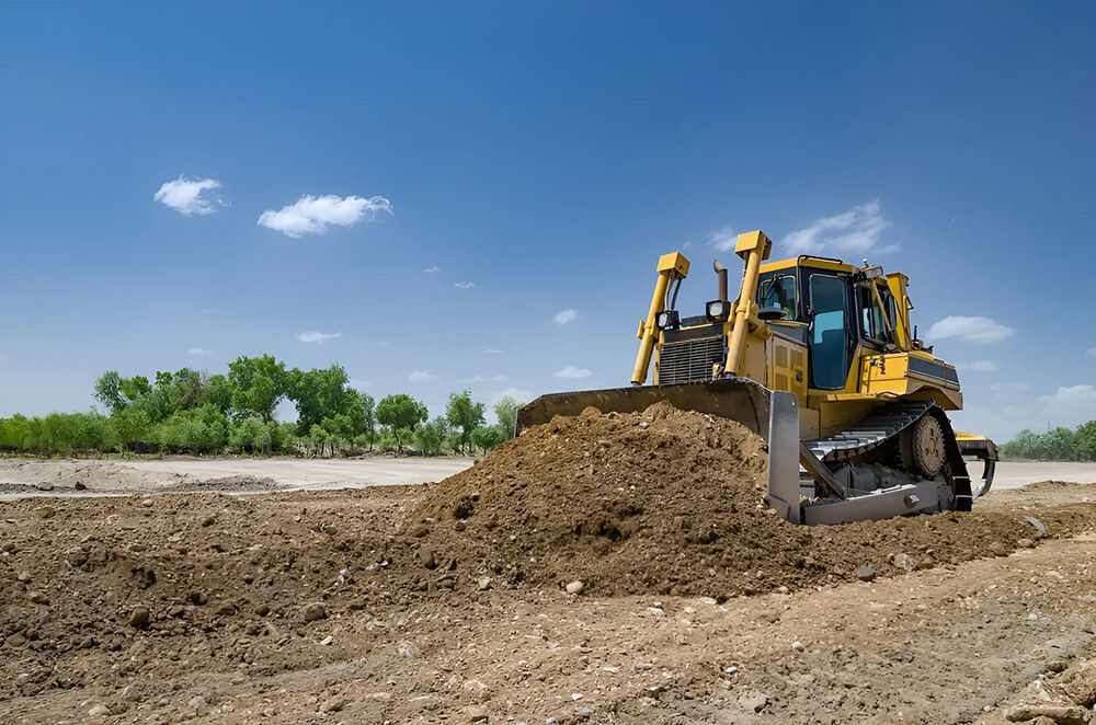 Yellow Bulldozer Moving Earth Pile