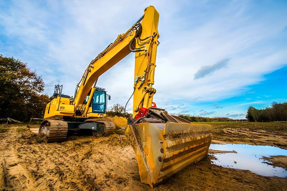 A Yellow Excavator Is Digging A Hole In The Dirt — Jeff Thompson Excavator Hire Pty Ltd In Pink Lily, QLD