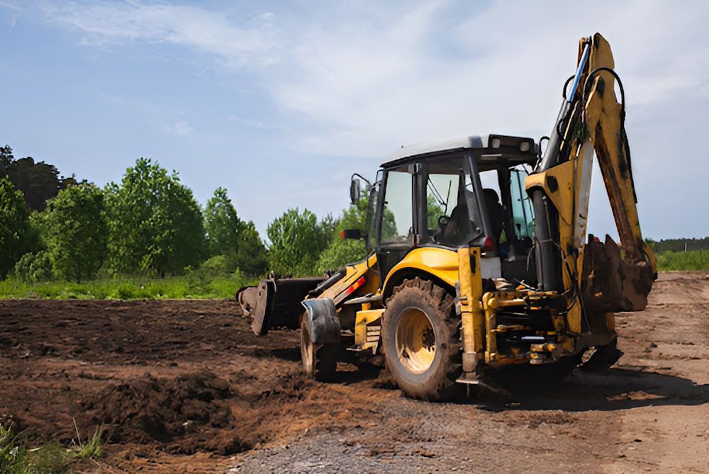A Yellow Excavator Is Digging A Hole In A Dirt Field — Jeff Thompson Excavator Hire Pty Ltd In Pink Lily, QLD