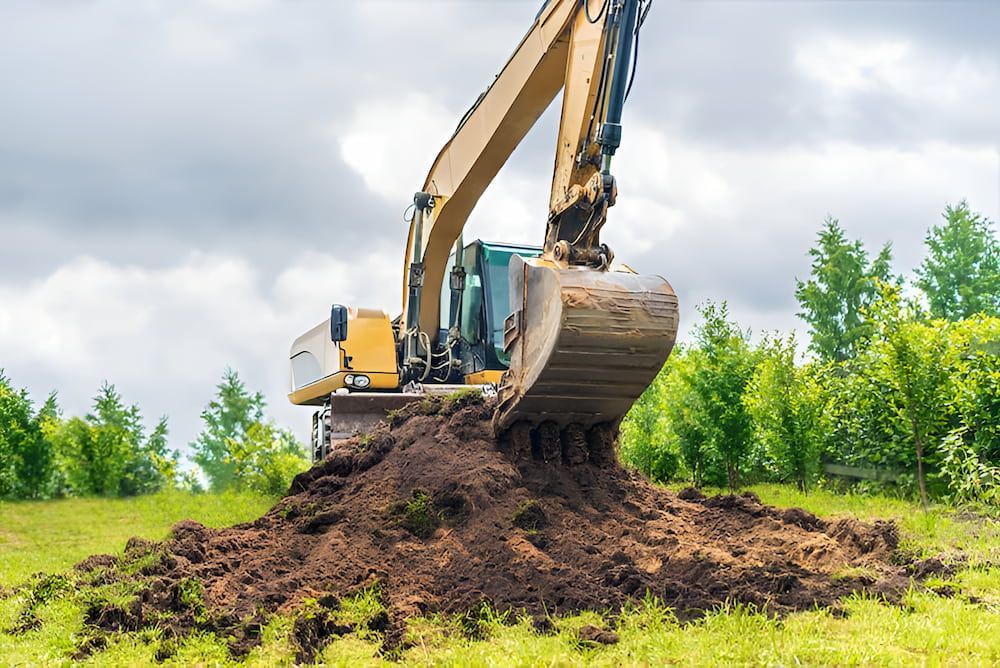 An Excavator Is Digging A Pile Of Dirt In A Field — Jeff Thompson Excavator Hire Pty Ltd In Pink Lily, QLD