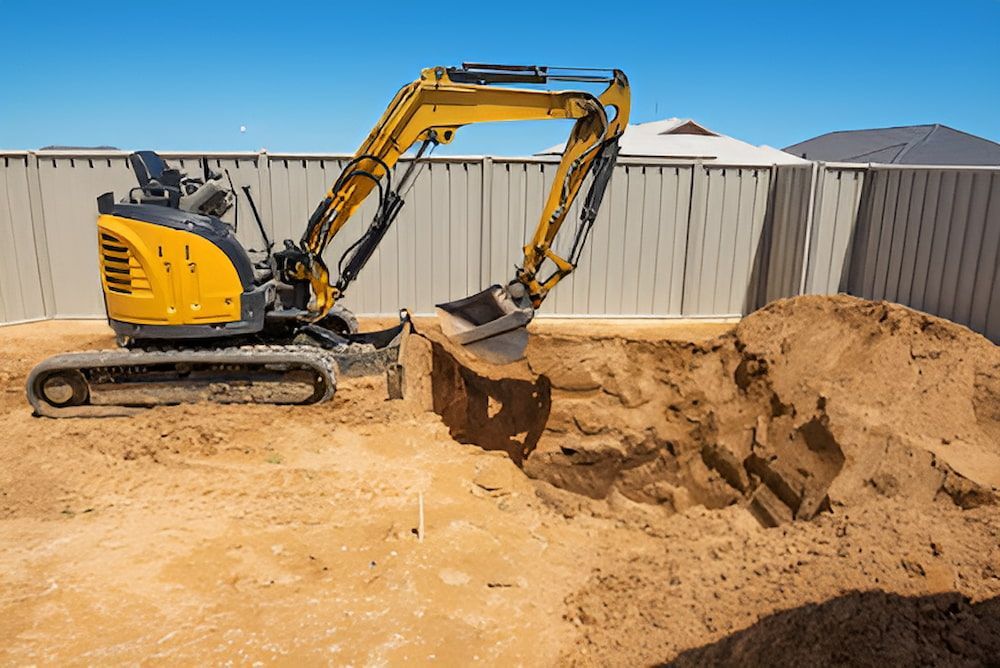 A Yellow Excavator Is Digging A Hole In The Ground — Jeff Thompson Excavator Hire Pty Ltd In Pink Lily, QLD