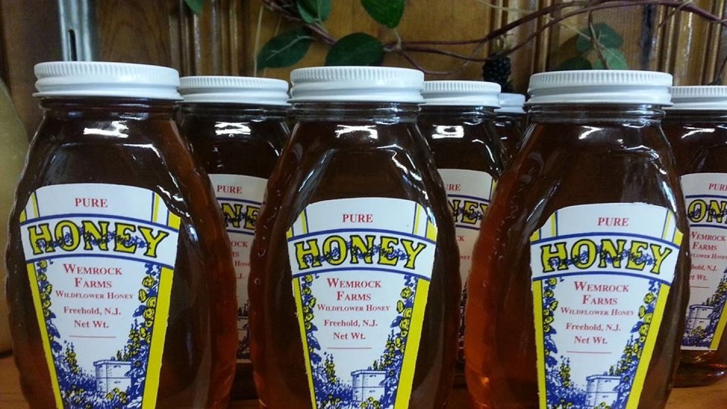 Bottles of amber honey with 