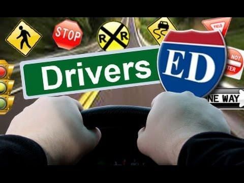 A person driving a car with a sign that says drivers ed