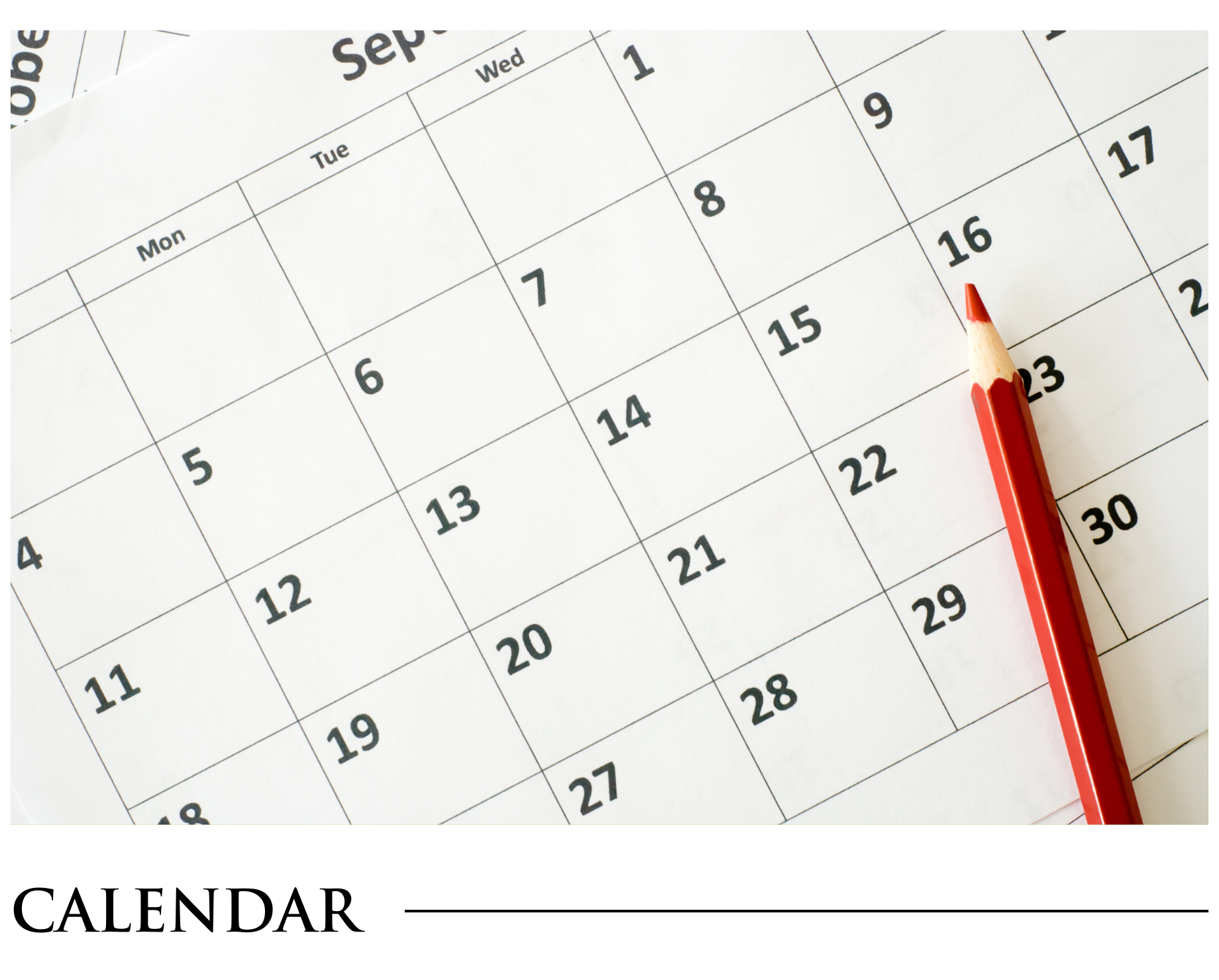 A calendar with a red pencil on it