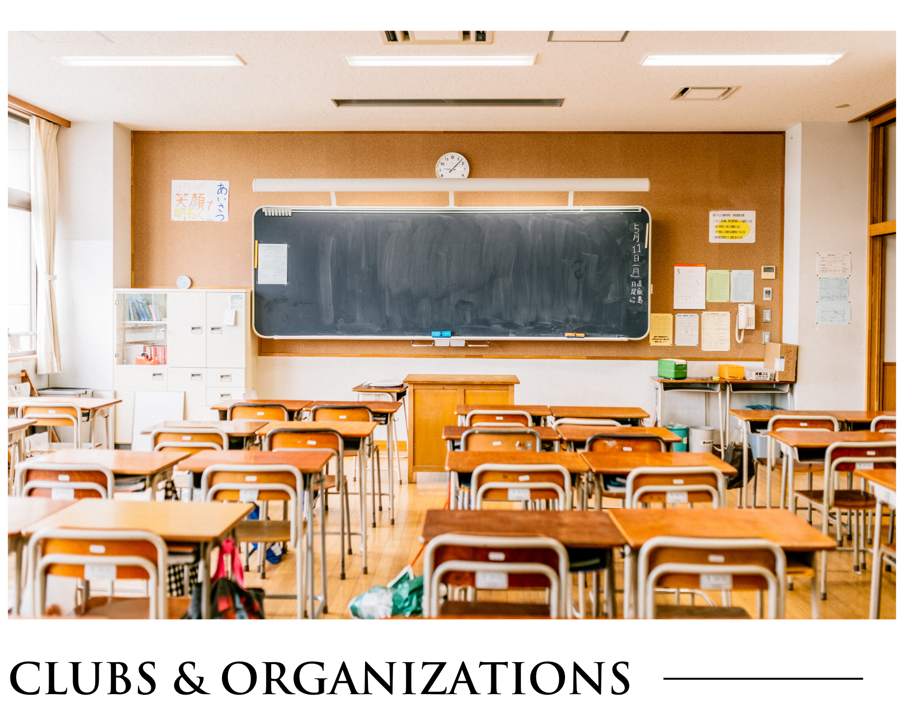 An empty classroom with tables and chairs and the words clubs and organizations below it