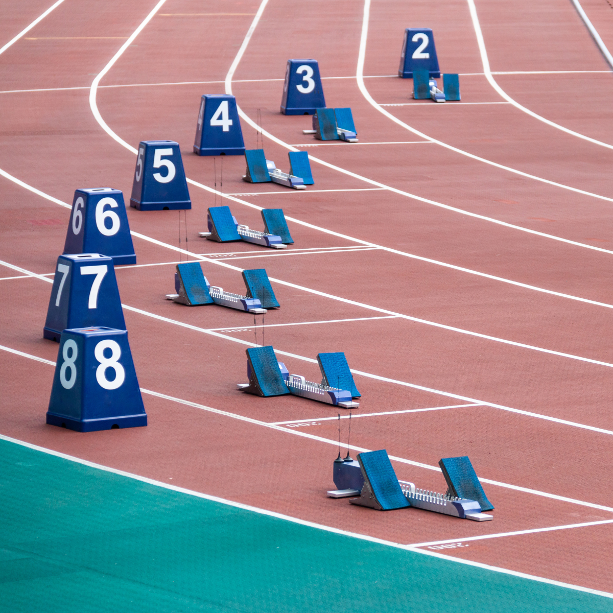 A row of starting blocks on a track with numbers on them