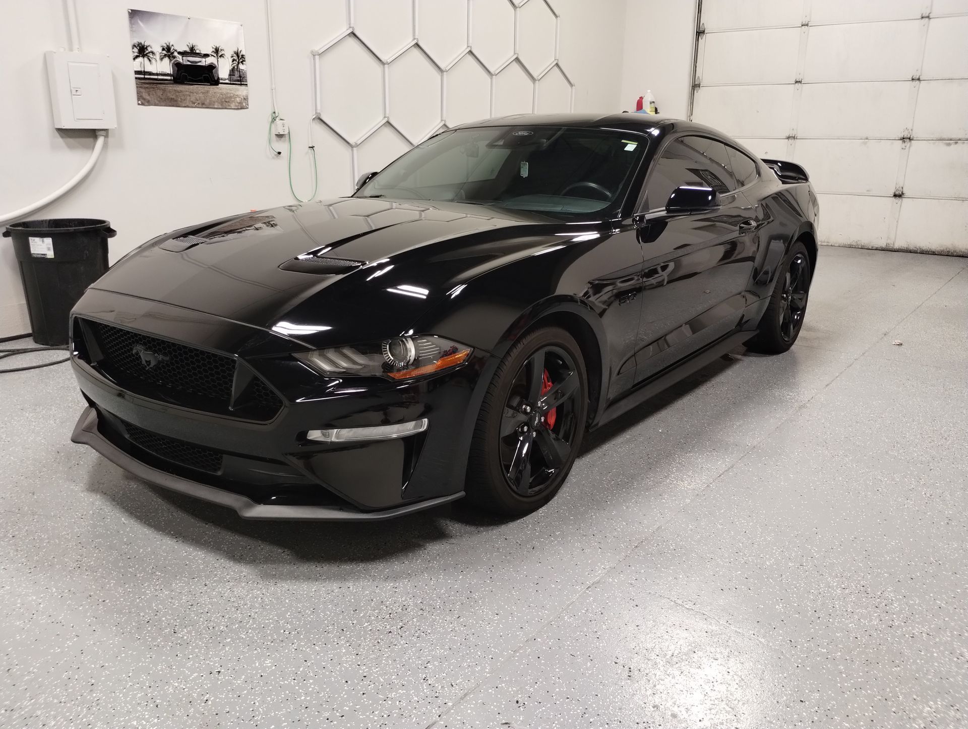 Ceramic coating being buffed into a car's paint.